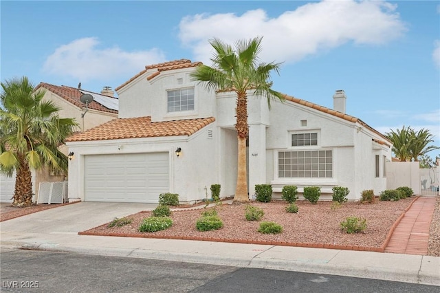 9405 Crosspointe Ave, Las Vegas, NV 89117 - mediterranean / spanish home with a tile roof, stucco siding, concrete driveway, and a chimney