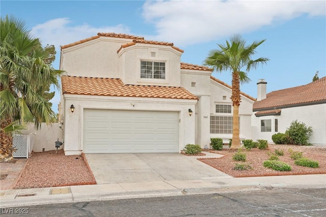 9405 Crosspointe Ave, Las Vegas, NV 89117 - mediterranean / spanish home featuring a tile roof, concrete driveway, stucco siding, and a garage
