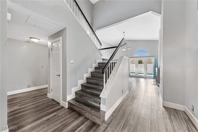 9405 Crosspointe Ave, Las Vegas, NV 89117 - stairs featuring wood finished floors, a high ceiling, and french doors