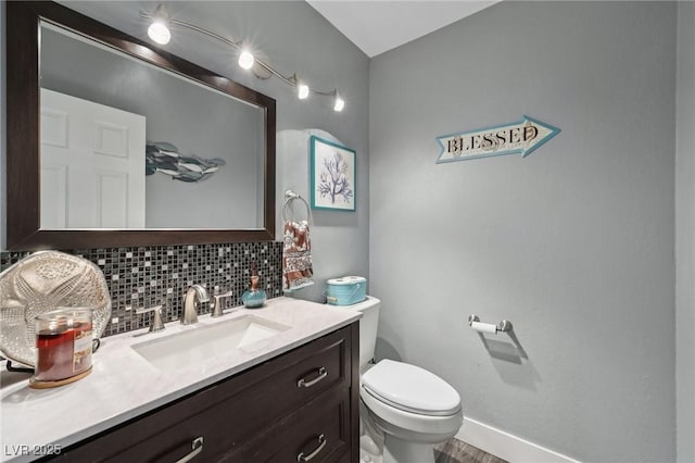 9405 Crosspointe Ave, Las Vegas, NV 89117 - half bathroom with backsplash, vanity, and wood finished floors