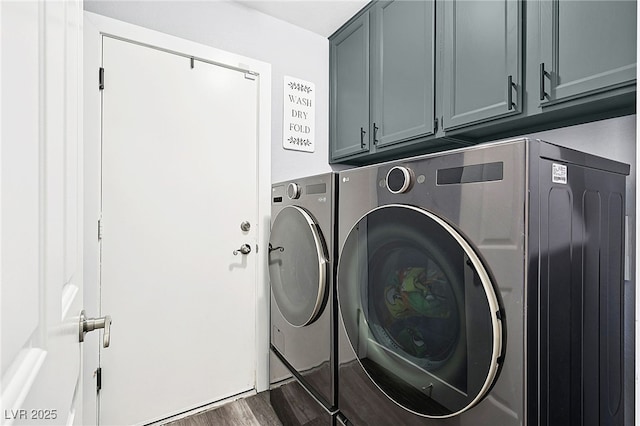 9405 Crosspointe Ave, Las Vegas, NV 89117 - laundry room with washer and clothes dryer, cabinet space, and dark wood-type flooring