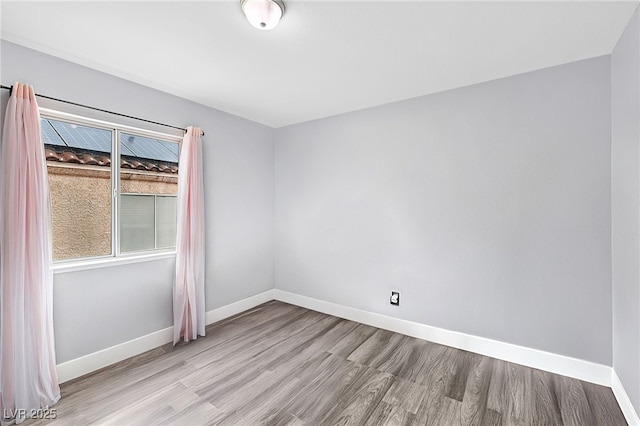 9405 Crosspointe Ave, Las Vegas, NV 89117 - unfurnished room featuring wood finished floors and baseboards