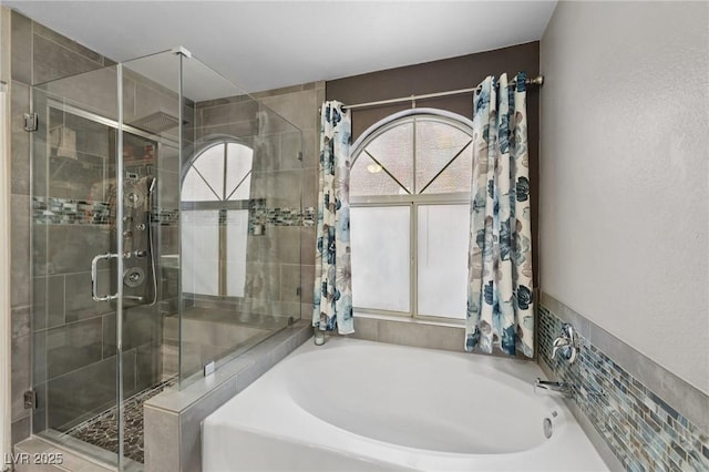 9405 Crosspointe Ave, Las Vegas, NV 89117 - full bathroom with plenty of natural light, a bath, and a shower stall