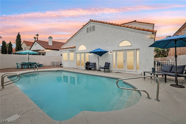 9405 Crosspointe Ave, Las Vegas, NV 89117 - view of swimming pool featuring french doors, a patio, and a fenced backyard