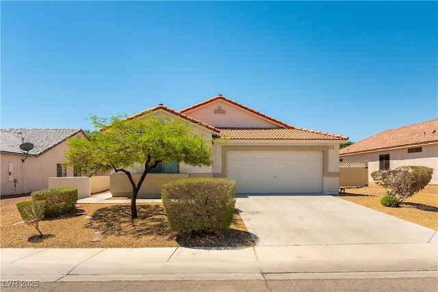 625 Bright Lights Ave, North Las Vegas, NV 89031 - mediterranean / spanish house featuring an attached garage, stucco siding, a tiled roof, and driveway