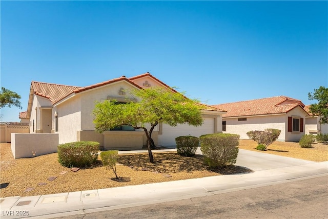 625 Bright Lights Ave, North Las Vegas, NV 89031 - view of front of house featuring a tiled roof, stucco siding, a garage, and concrete driveway
