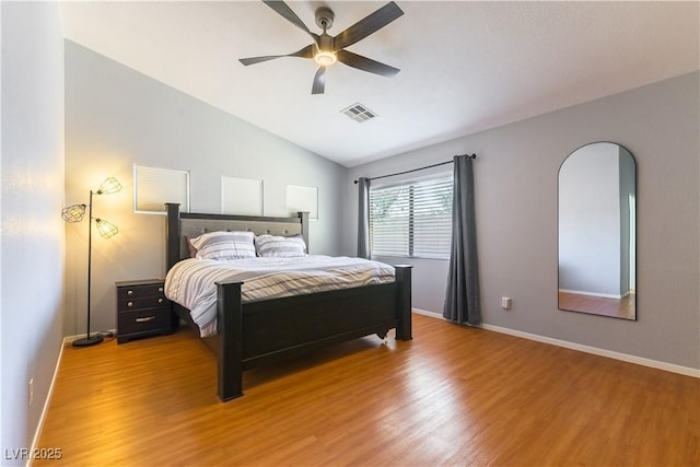 625 Bright Lights Ave, North Las Vegas, NV 89031 - bedroom with light wood-type flooring, vaulted ceiling, and a ceiling fan