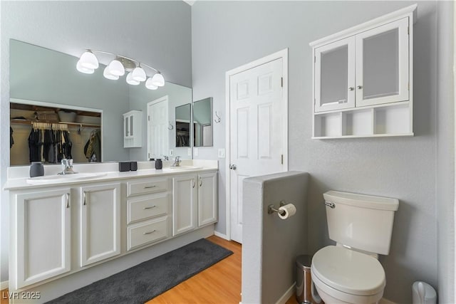 625 Bright Lights Ave, North Las Vegas, NV 89031 - bathroom with double vanity, wood finished floors, and a closet