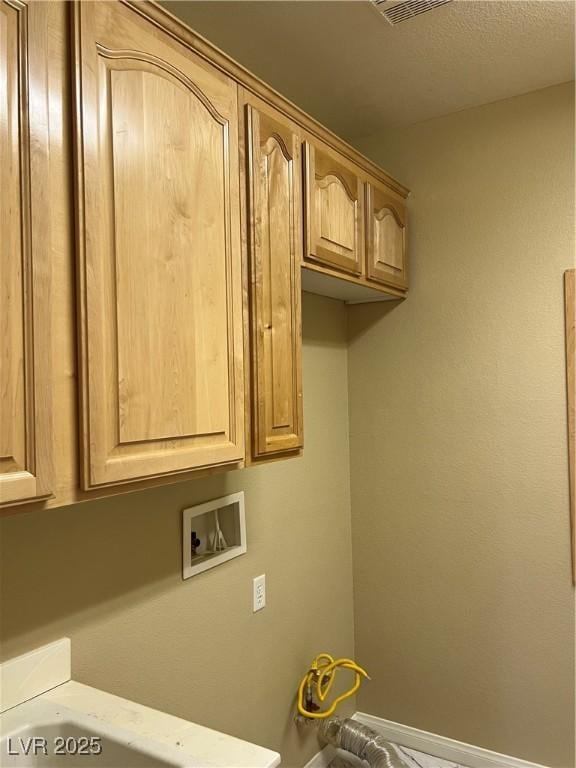 11004 Mount Royal Ave, Las Vegas, NV 89144 - laundry area with washer hookup and cabinet space
