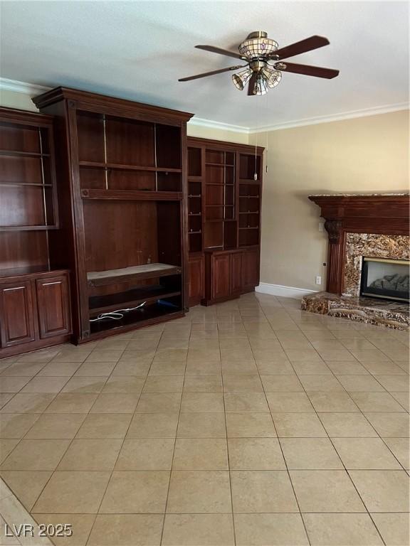 11004 Mount Royal Ave, Las Vegas, NV 89144 - unfurnished living room with crown molding, ceiling fan, a fireplace, and light tile patterned floors