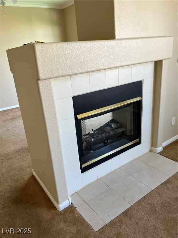 11004 Mount Royal Ave, Las Vegas, NV 89144 - detailed view of a tiled fireplace, carpet flooring, and crown molding