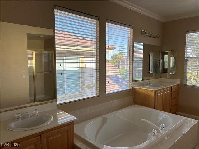 11004 Mount Royal Ave, Las Vegas, NV 89144 - bathroom featuring a bath, vanity, plenty of natural light, ornamental molding, and a stall shower