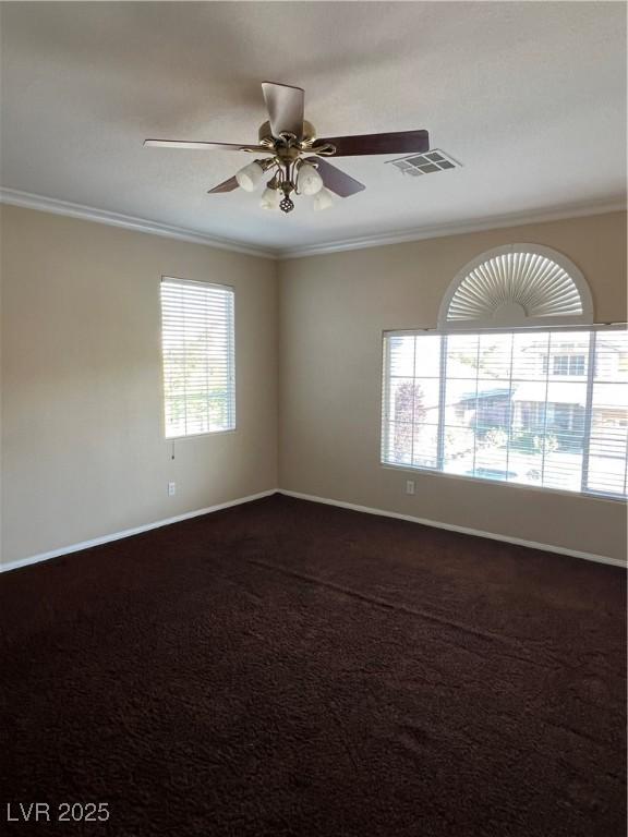11004 Mount Royal Ave, Las Vegas, NV 89144 - spare room with crown molding, ceiling fan, and dark colored carpet