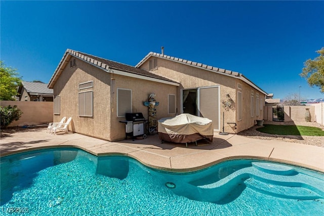 8266 Lincoln Valley St, Las Vegas, NV 89123 - rear view of property featuring a patio area, a fenced backyard, and stucco siding
