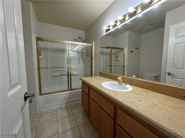 5449 Bugle Way Unit 105, Las Vegas, NV 89108 - bathroom with vanity, bath / shower combo with glass door, and tile patterned floors