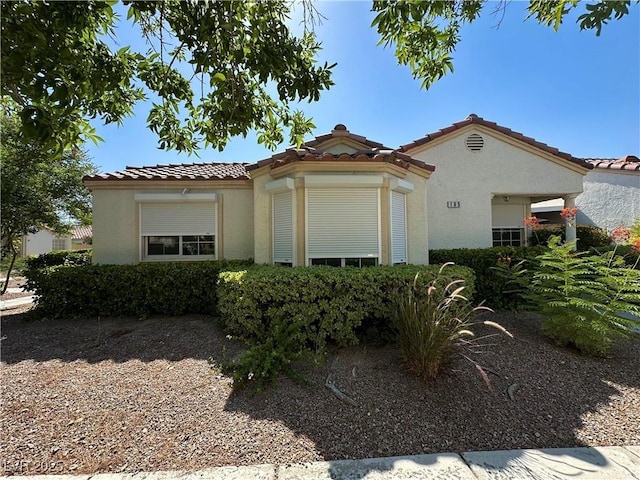 5449 Bugle Way Unit 105, Las Vegas, NV 89108 - mediterranean / spanish-style home featuring a tile roof and stucco siding