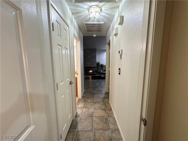 5449 Bugle Way Unit 105, Las Vegas, NV 89108 - hallway with a textured wall and baseboards