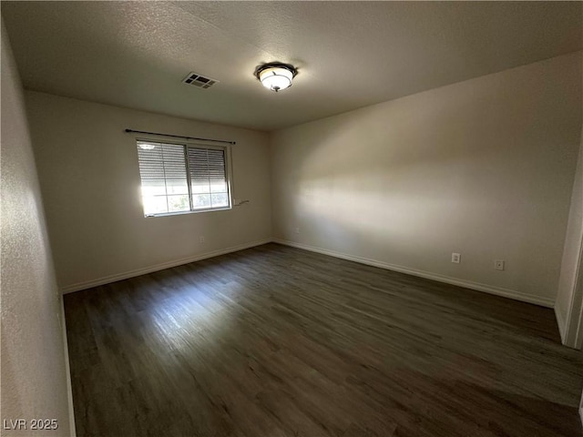 5449 Bugle Way Unit 105, Las Vegas, NV 89108 - empty room with dark wood-style flooring and baseboards
