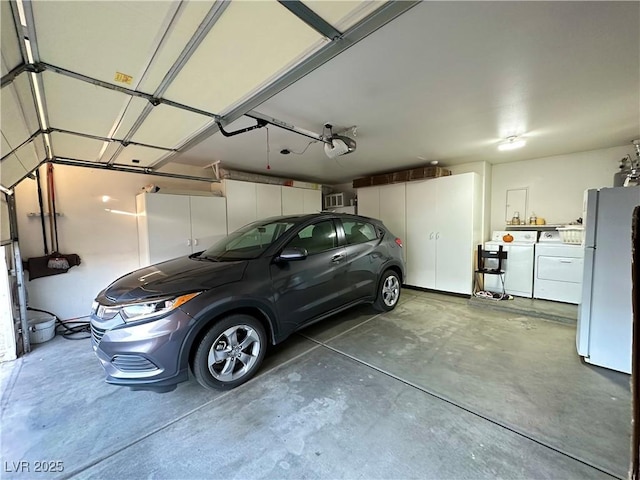 5449 Bugle Way Unit 105, Las Vegas, NV 89108 - garage with freestanding refrigerator, a garage door opener, and independent washer and dryer