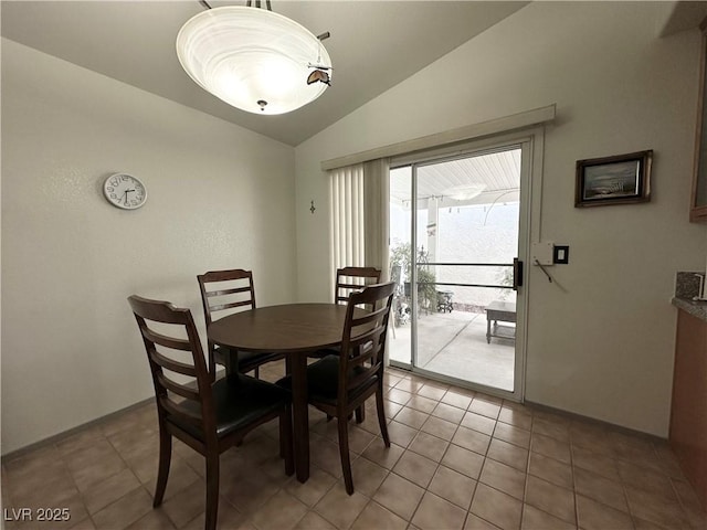 5449 Bugle Way Unit 105, Las Vegas, NV 89108 - dining room featuring lofted ceiling and light tile patterned floors