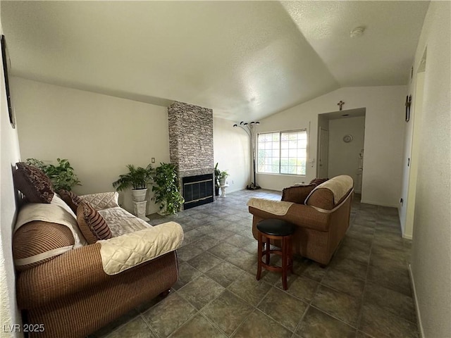 5449 Bugle Way Unit 105, Las Vegas, NV 89108 - living room featuring vaulted ceiling and a fireplace