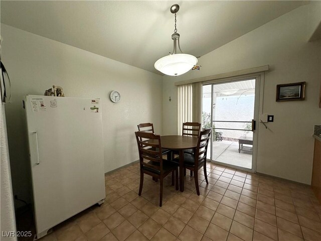 5449 Bugle Way Unit 105, Las Vegas, NV 89108 - dining space with lofted ceiling and light tile patterned floors