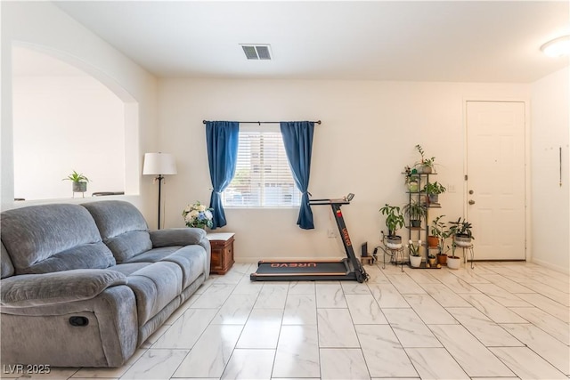 6312 Beige Bluff St Unit 102, North Las Vegas, NV 89081 - living room with light marble finish floors and arched walkways