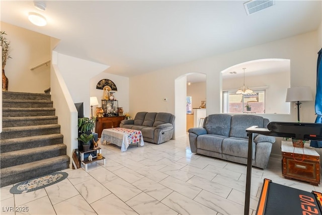 6312 Beige Bluff St Unit 102, North Las Vegas, NV 89081 - living area with arched walkways, light marble finish floors, and stairs