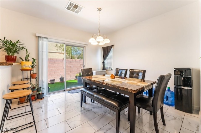 6312 Beige Bluff St Unit 102, North Las Vegas, NV 89081 - dining room featuring light marble finish floors and a chandelier