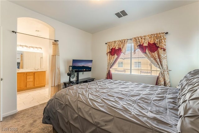 6312 Beige Bluff St Unit 102, North Las Vegas, NV 89081 - bedroom featuring ensuite bathroom and light carpet