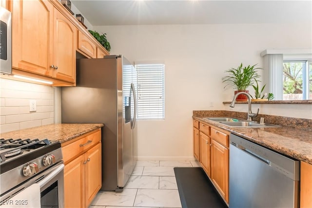 6312 Beige Bluff St Unit 102, North Las Vegas, NV 89081 - kitchen with stainless steel appliances, light marble finish flooring, decorative backsplash, light brown cabinets, and light stone counters