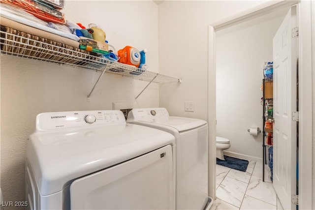 6312 Beige Bluff St Unit 102, North Las Vegas, NV 89081 - laundry area featuring washing machine and clothes dryer and light marble finish flooring