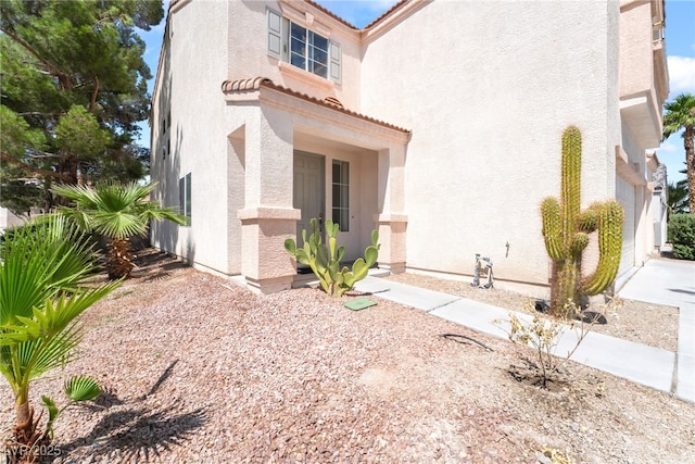 4062 W El Campo Grande Ave, North Las Vegas, NV 89031 - view of front of home with stucco siding and a tile roof