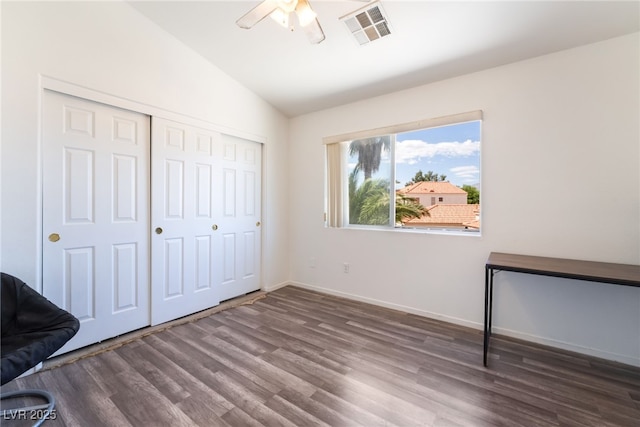 4062 W El Campo Grande Ave, North Las Vegas, NV 89031 - unfurnished bedroom with lofted ceiling, wood finished floors, a closet, and a ceiling fan