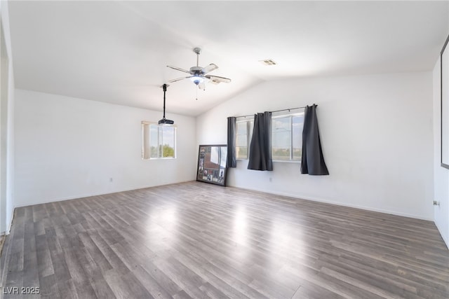 4062 W El Campo Grande Ave, North Las Vegas, NV 89031 - unfurnished living room with healthy amount of natural light, a ceiling fan, lofted ceiling, and wood finished floors