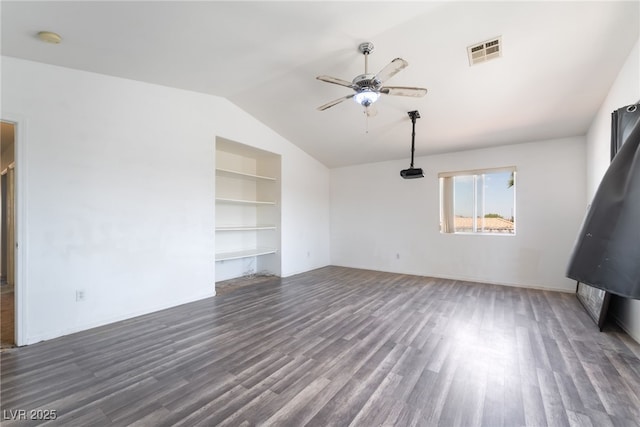 4062 W El Campo Grande Ave, North Las Vegas, NV 89031 - unfurnished living room with a ceiling fan, vaulted ceiling, wood finished floors, and built in features