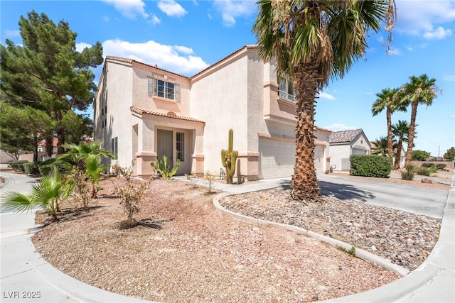 4062 W El Campo Grande Ave, North Las Vegas, NV 89031 - mediterranean / spanish house featuring stucco siding, an attached garage, a tiled roof, and driveway