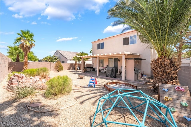 4062 W El Campo Grande Ave, North Las Vegas, NV 89031 - back of house with stucco siding, a fenced backyard, a patio area, and a pergola