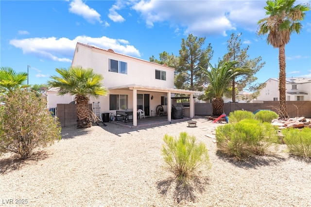 4062 W El Campo Grande Ave, North Las Vegas, NV 89031 - back of house with a fenced backyard, a patio area, and stucco siding