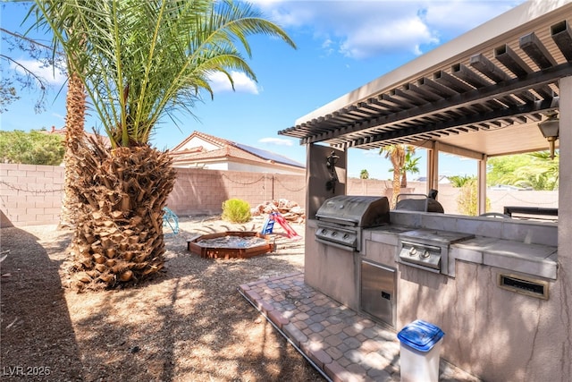 4062 W El Campo Grande Ave, North Las Vegas, NV 89031 - fenced backyard with area for grilling and a patio area