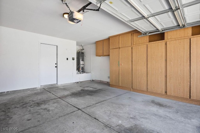 4319 Basil Leaf Ave, North Las Vegas, NV 89031 - garage featuring water heater and a garage door opener