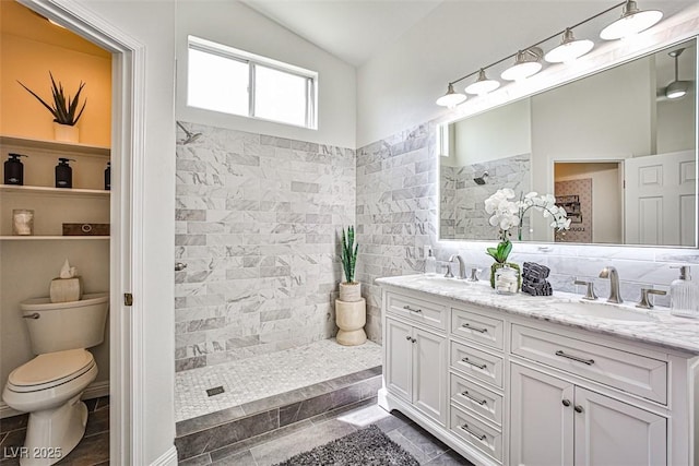 920 Siena Hills Ln, Las Vegas, NV 89144 - bathroom featuring double vanity, walk in shower, lofted ceiling, and tile walls