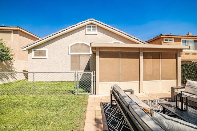 920 Siena Hills Ln, Las Vegas, NV 89144 - rear view of property featuring a sunroom, stucco siding, a tiled roof, and a patio area