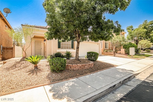 920 Siena Hills Ln, Las Vegas, NV 89144 - obstructed view of property with concrete driveway, stucco siding, and an attached garage