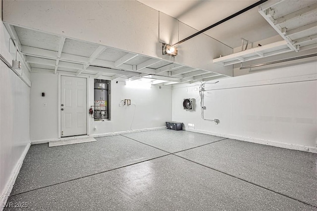920 Siena Hills Ln, Las Vegas, NV 89144 - garage featuring strapped water heater and baseboards
