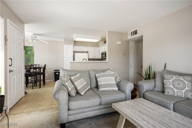 3042 Tarpon Dr Unit 202, Las Vegas, NV 89120 - living area with a ceiling fan and light tile patterned flooring