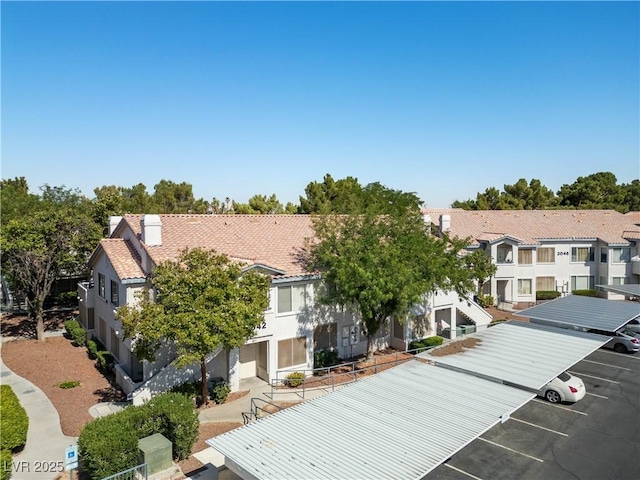 3042 Tarpon Dr Unit 202, Las Vegas, NV 89120 - view of building exterior with uncovered parking and a residential view