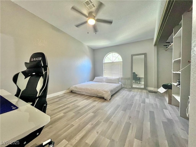 2627 S Durango Dr Unit 202, Las Vegas, NV 89117 - bedroom featuring wood finished floors, vaulted ceiling, and ceiling fan