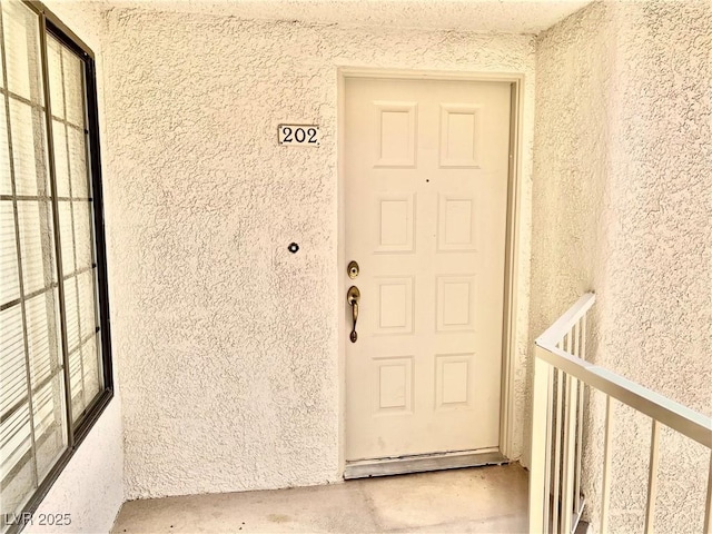 2627 S Durango Dr Unit 202, Las Vegas, NV 89117 - doorway to property featuring stucco siding