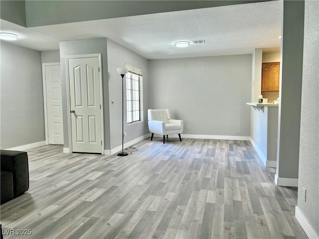 2627 S Durango Dr Unit 202, Las Vegas, NV 89117 - unfurnished room with light wood finished floors and baseboards